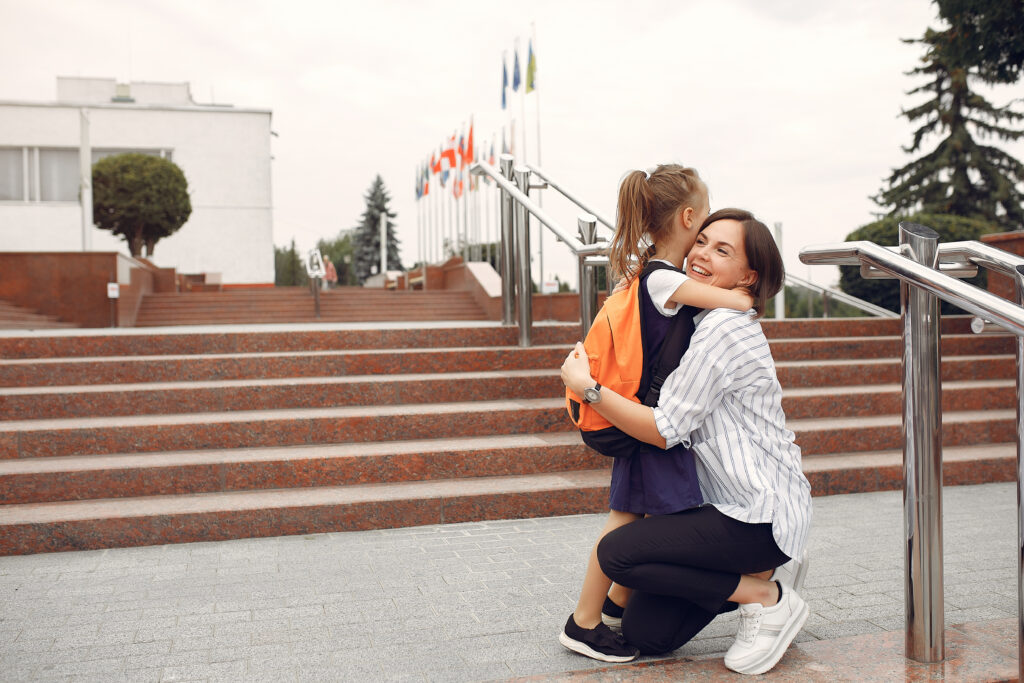 TEACHERS CLIMBING STAIRS OF SCHOOL HAPPILY